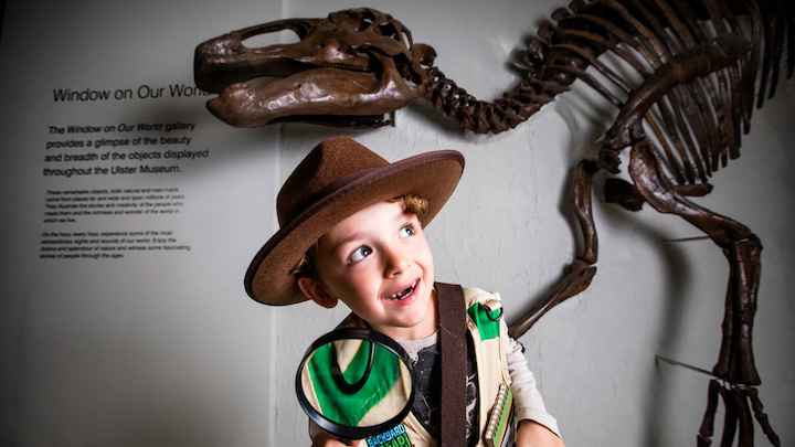 Boy in front of a Dinosaur Skeleton at Ulster Museum Belfast